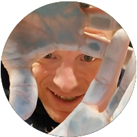 Zach Duncan-tessmer seen between clay coated hands